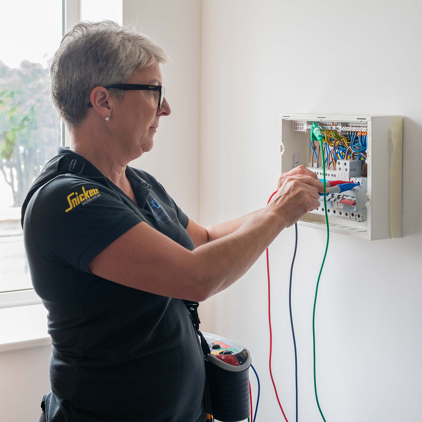 EICR Services this image shows Karen testing a consumer unit