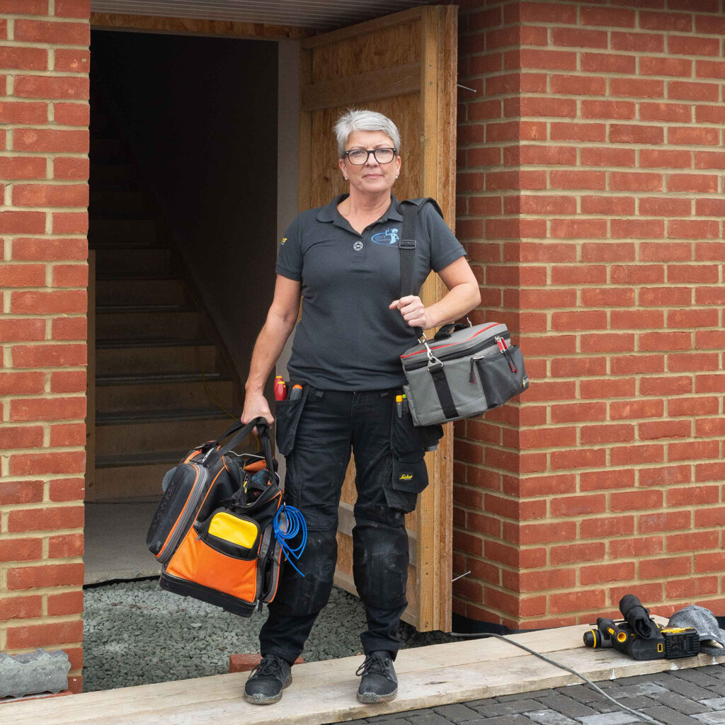 Wiring and Rewiring Services this image shows Karen arriving at a property with all her electrician tools